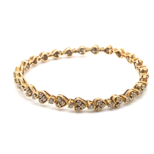 Radiant Heart 18K Yellow Gold Diamond Bangle - Heart-shaped motif with sparkling diamonds on rich gold backdrop.